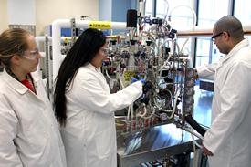 Image of Students and Instructor Working with Bioreactor